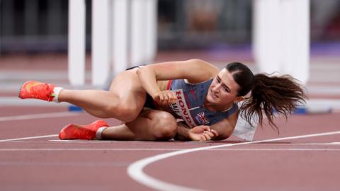 Abigail Pawlett on the track after falling in the 100m hurdles