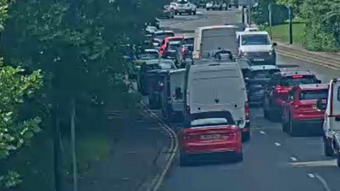 Cars queueing up on busy road