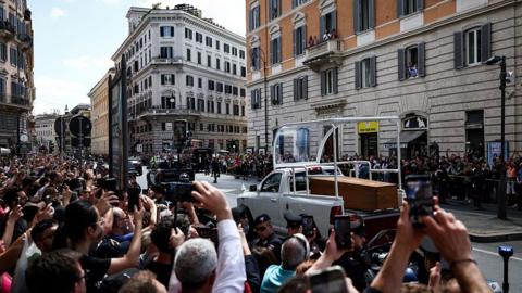 pope's coffin driven through rome