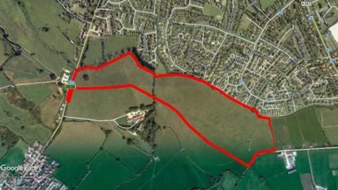 Aerial image of land outlined for development near Trowbridge in Wiltshire