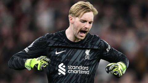 Caoimhin Kelleher celebrates while playing for Liverpool