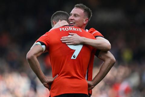 Cauley Woodrow hugs Carlton Morris