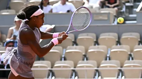 Coco Gauff hits a backhand
