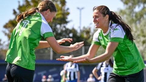 Footballers Calleigh Hedley and Chloe Ingrouille playing for Guernsey FC Women against Wimborne Town in the Southern Region Women's Football League Division One South