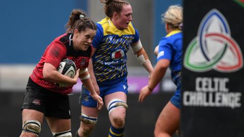 Natalia John carries the ball for Brython Thunder 