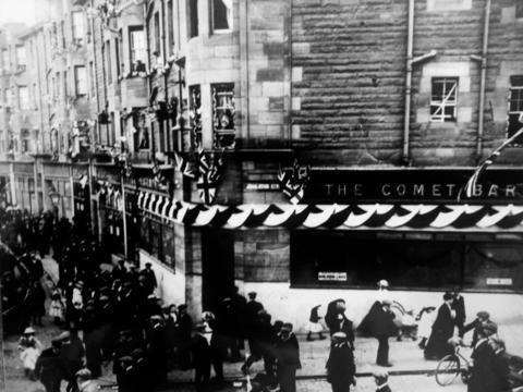 An old photograph with Union flags hung outside