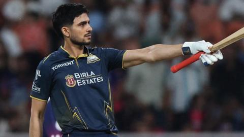 Gujarat Titans' Shubman Gill celebrates after reaching his century