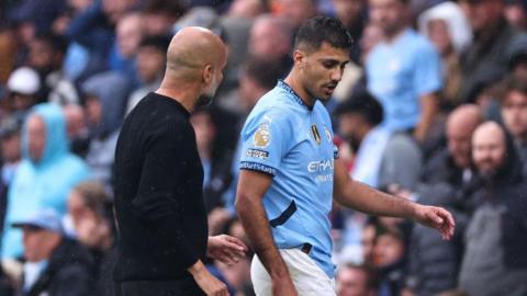 Rodri and Pep Guardiola