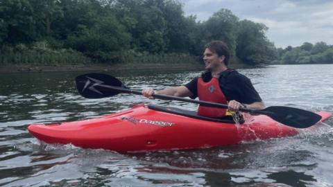 Oscar Matthews in his kayak