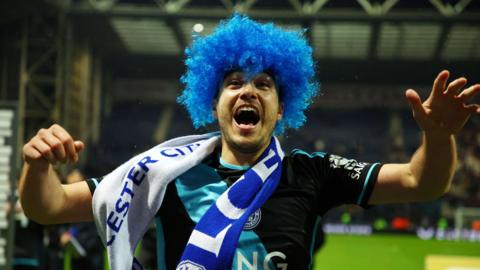 Harry Winks celebrates winning promotion with Leicester City