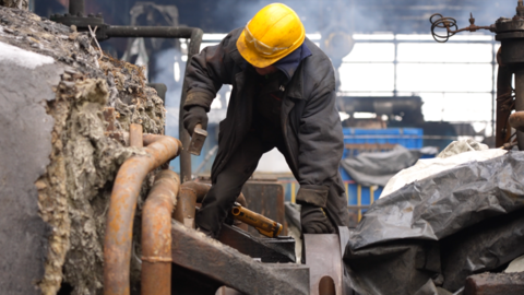 A worker tries to fix a power plant in Ukraine