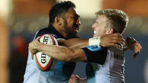 Connacht centre Bundee Aki celebrates with try scorer Ben Murphy against Scarlets