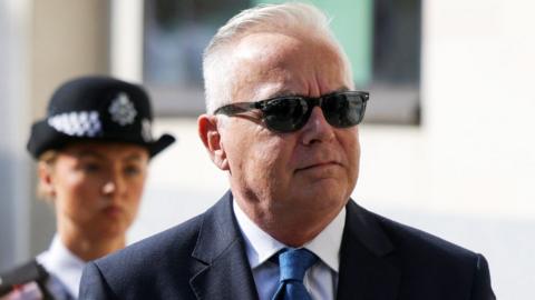 Former 鶹ҳ news presenter Huw Edwards walks outside Westminster Magistrates' Court after being charged with indecent child picture crimes on the day of a hearing, in London, Britain, July 31, 2024