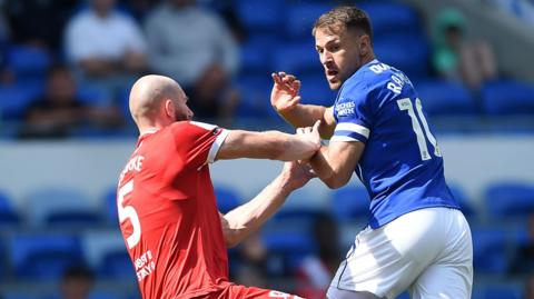 Matt Clarke (left) of Middlesbrough challenges Aaron Ramsey of Cardiff