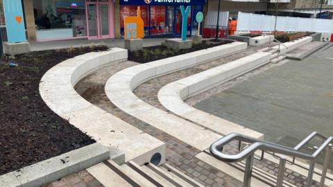Seating surrounding a large paved area in Yeovil town centre.