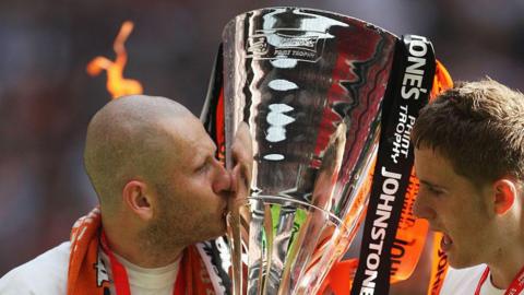 Kevin Nicholls of Luton Town kisses the trophy after victory in the Johnstone's Paint Trophy Final match between Luton Town and Scunthorpe United at Wembley Stadium in 2009
