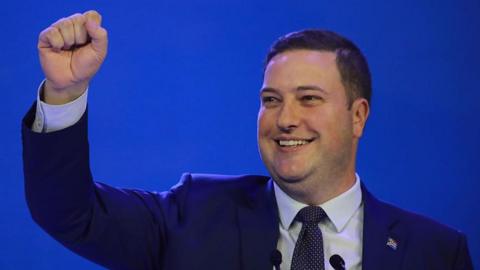 Geordin Hill-Lewis is seen with his fist raised after his election as the DA's new leader