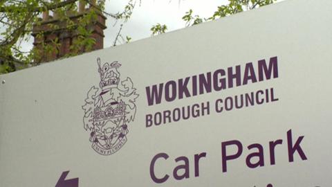 A white sign bears the words "Wokingham Borough Council" above the words "car park"