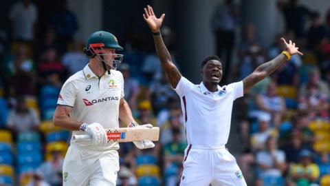 Alzarri Joseph (R) of West Indies unsuccessfully appeals against Beau Webster (L) of Australia
