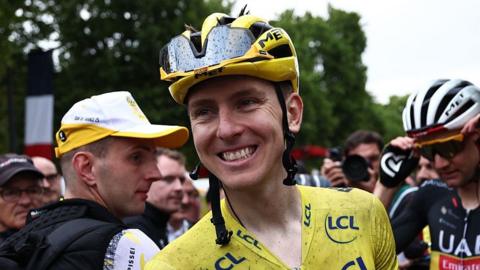 Tadej Pogacar smiles after winning the 2025 Tour de France