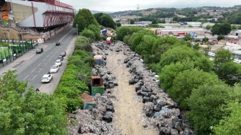 Bags and piles of waste next to Bradford's Valley Parade stadium