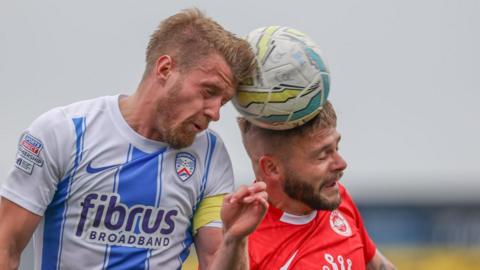 Coleraine's Lyndon Kane and Andy Ryan contest a high ball