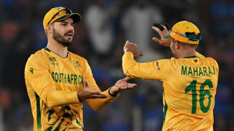 South Africa's Aiden Makram and Keshav Maharaj clasps hands during the T20 World Cup