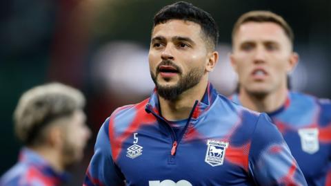 pswich Town's Sam Morsy warms up ahead of a Premier League match