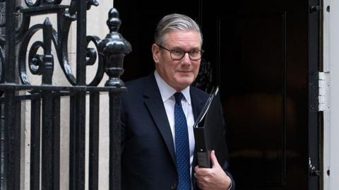 Starmer coming out of No 10 holding a folder