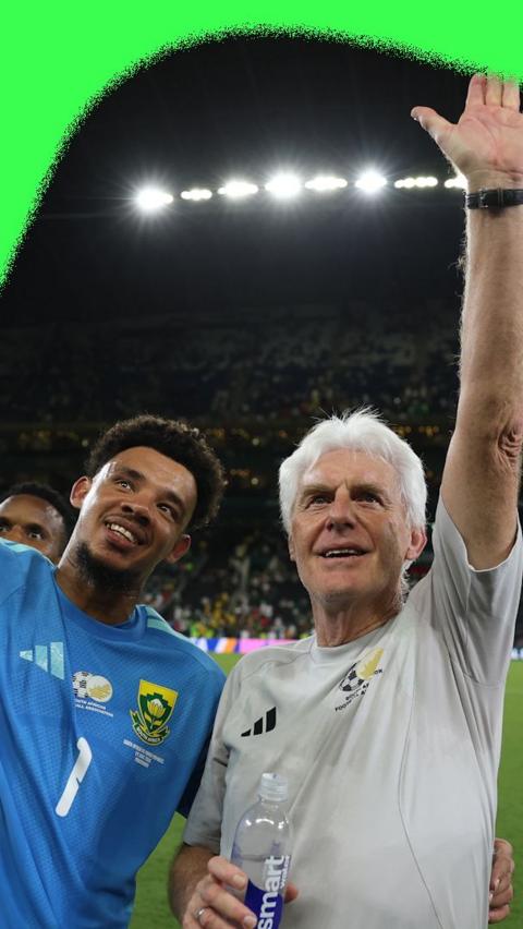Hugo Broos and Ronwen Williams celebrating together