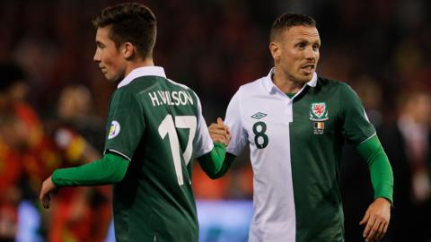 Harry Wilson with Craig Bellamy after Wales' draw in Belgium in 2013