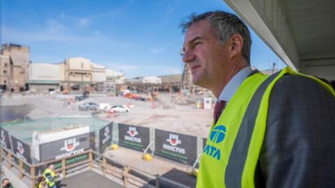 Business and Trade Secretary Peter Kyle wearing a hi-vis vest during a visit to Tata Steel's Port Talbot plant.