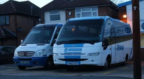 Flagfinder coaches parked on the drive of a home