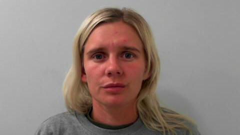 Custody picture of a woman with blonde hair and a grey sweater.