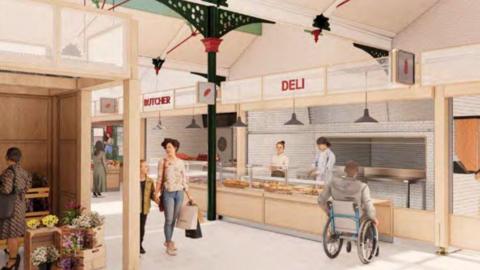 There are serving areas with the words butcher and deli above. Two people are behind a counter, with at least five other people also in the image.