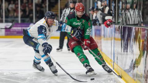 Coventry's Michael Pelech challenges Cardiff's Joey Martin for the puck