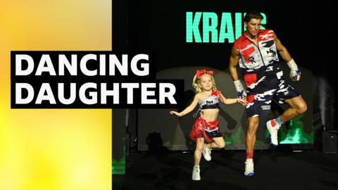 Gradus Kraus dances with his daughter on a ringwalk