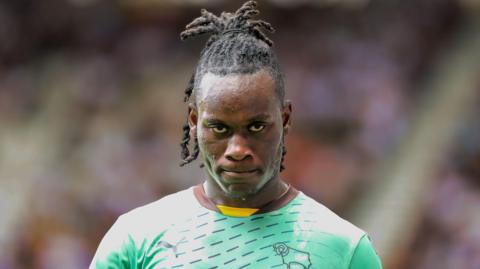 David Ozoh looks towards the camera while in action for Derby County