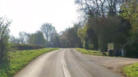 A google maps streetview image of the country road near the farm.