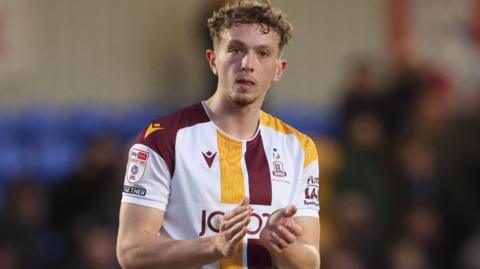 Michael Mellon claps the fans after a Bradford City match