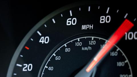 A close up stock image of a cars speedometer 