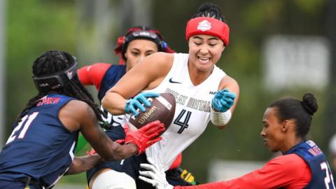 Angelica Tait is tackled during Great Britain's semi-final defeat by the USA at the 2026 Flag Football World Championships