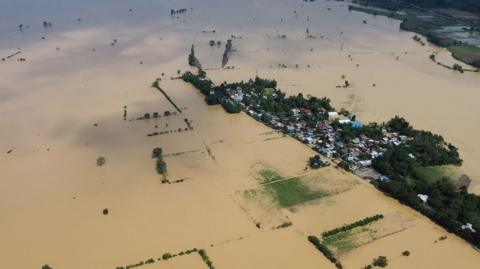 Fields flooded by muddy water, seen from above