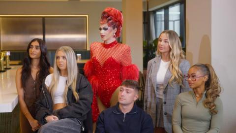 A group of people looking at someone off camera.