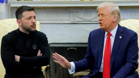 Volodymyr Zelenskiy and Donald Trump are sitting next to each other.