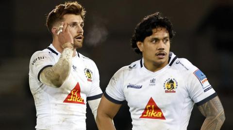 England's Henry Slade (left) and Australia's Len Ikitau chat while playing for Exeter