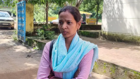 Jyoti Yadav standing alone in front of a pavement