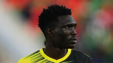 Rogers Mato in action for Uganda