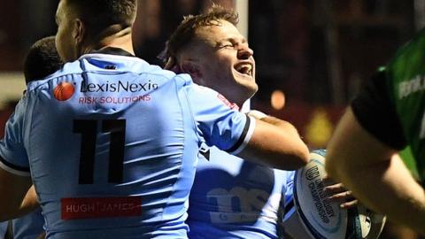 Cardiff's Hallam Amos celebrates his try with Jason Harries