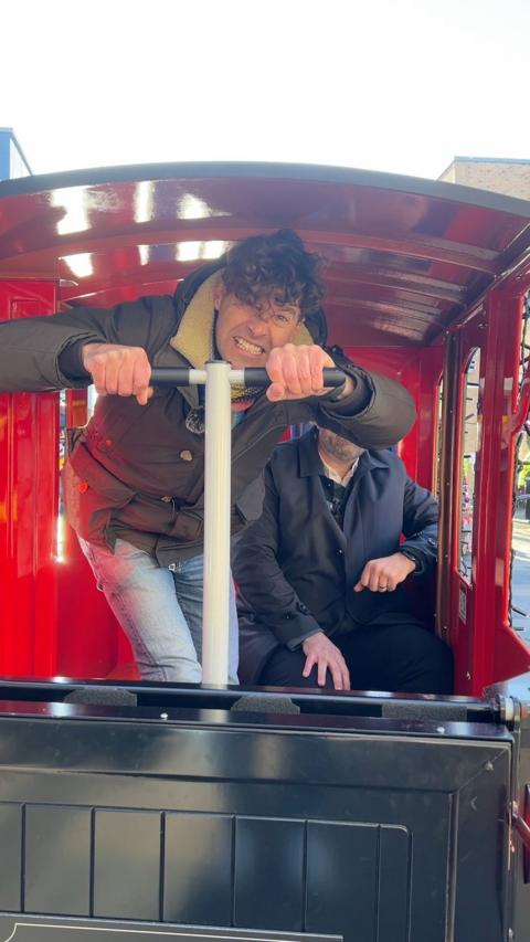 Rich Clake sat on the back of the Lexicon Express turning the shopping centre's Christmas lights